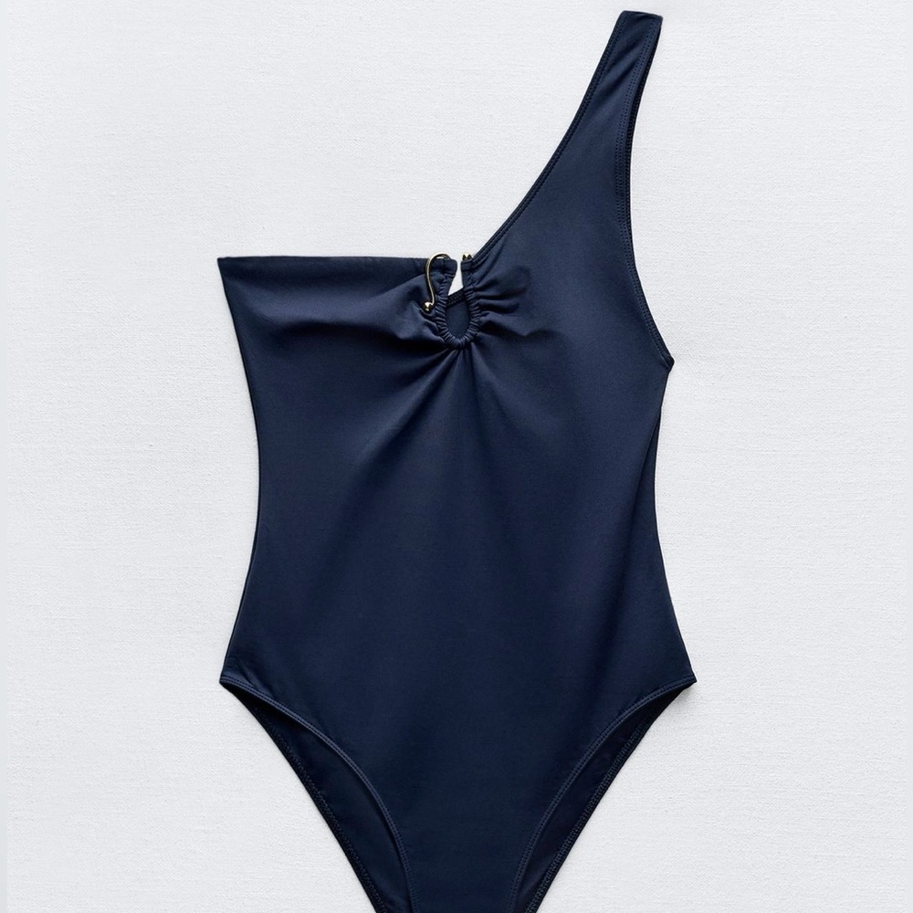 NEW ASYMMETRIC SWIMSUIT.